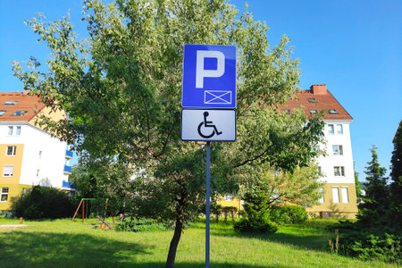 Road sign Disabled Parking in modern residential neighborhood.の写真素材