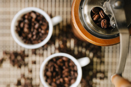 two cups of coffee with coffee beans on a wooden table
