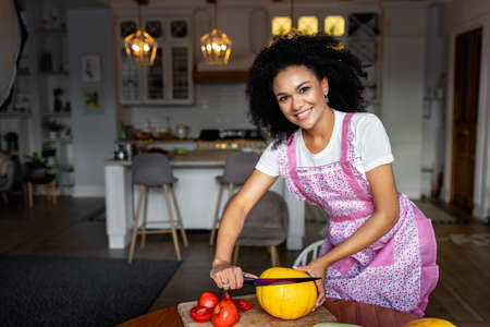 young woman cooking in the kitchenの写真素材