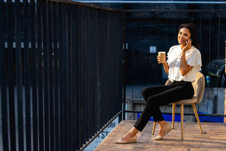 business young girl talking on the phoneの写真素材