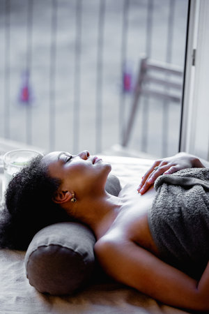beautiful girl relaxing in spaの写真素材