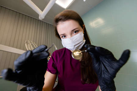 beautiful woman doctor with dental equipment in dentistryの写真素材