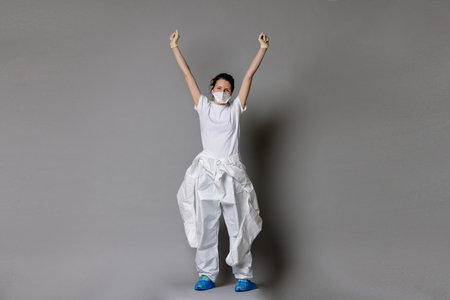 Frontliner in happy mood in hazmat suit.