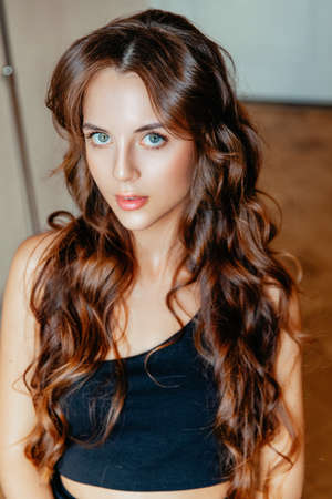 Beautiful woman with long wavy hair . Beauty ,makeup and cosmetics .の写真素材