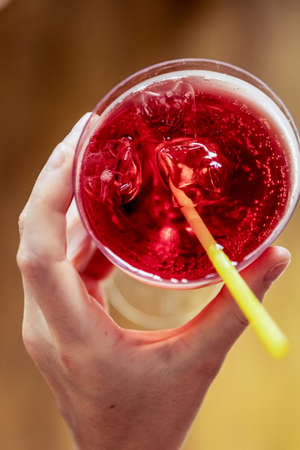 Beautiful glass with a refresh cocktail red colorの写真素材