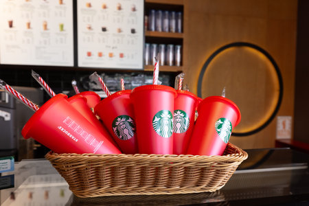 DUBAI - NOVEMBER, 2022: Starbucks Red Christmas cup on the table at Starbucksのeditorial素材