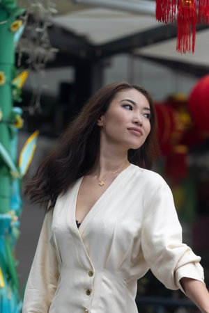 Chinese lanterns. Beautiful Asian girl in white dress with attractive faceの写真素材