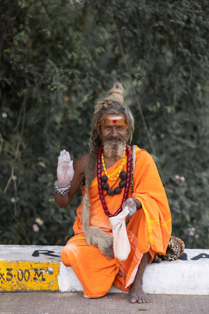 AMILNADU INDIA - FEB 15, 2023: Old Indian Hindu sadhu with dread-lock beard and white sacred ash on his forehead poses for the cameraのeditorial素材
