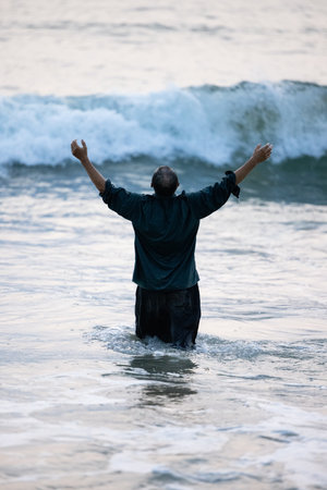 A man is carelessly swimming in the ocean.の写真素材