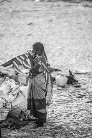February 14, 2023, Chennai city, India: Nomadic people of India in their traditional clothes, against the backdrop of their place of residence.のeditorial素材