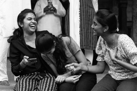 Mysore, India - October 27, 2022: Two local girls are laughing on the street.のeditorial素材