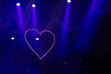 Fluorescent lamp in the shape of a heart. There is space for text.の写真素材