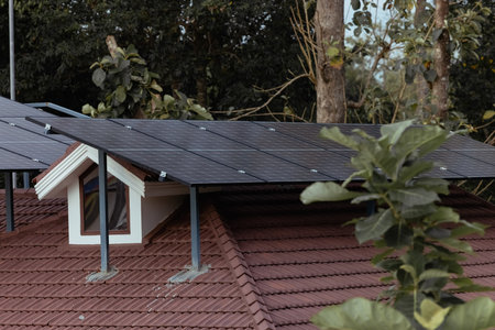 Private home roof covered with solar photovoltaic panelsの写真素材