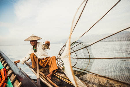 Inle Lake fishermen at sunset in Myanmar Burmaの写真素材