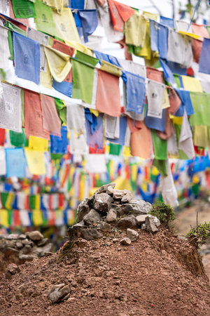Wind horses.Lung ta prayer flags hang along a mountain pathの写真素材
