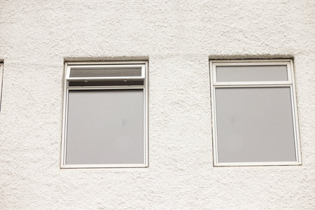 Real modern house window frame isolated on white wallの写真素材