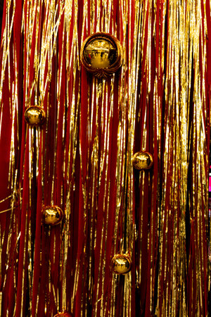 Festive background with gold balloons and scattered golden confetti.