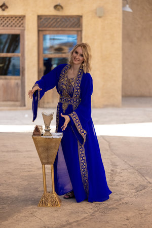 A European woman in an Arab national costume.の写真素材