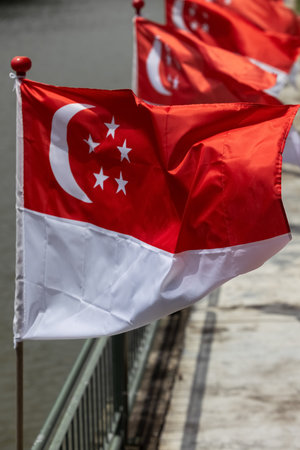 Several Singaporean flags are fluttering in the wind.の写真素材