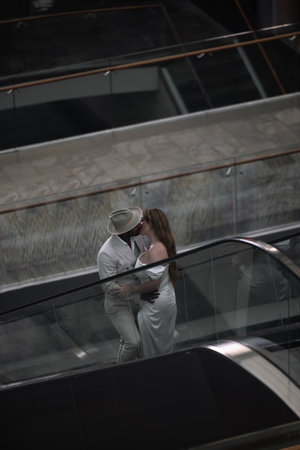 International wedding. The handsome dark-skinned groom in a white suitの写真素材