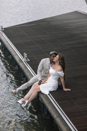 International wedding. The groom in a white suitの写真素材