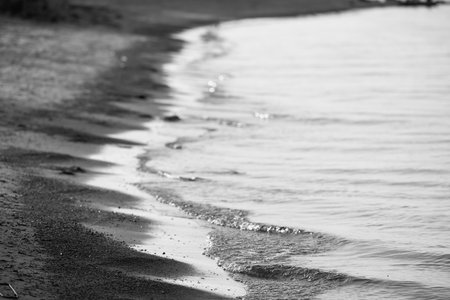 Close up view of the beach being wet by the tideの写真素材
