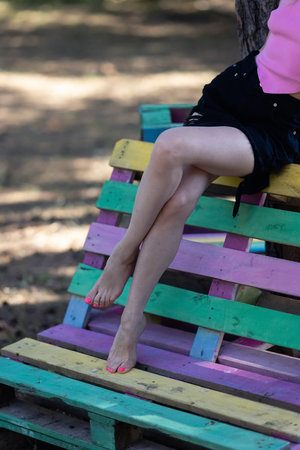 Smoothly shaved legs of a young Caucasian fair-skinned woman.の写真素材