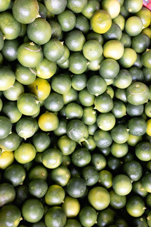 Fresh Limes pile sell in traditional market indonesia. Selective Focus. beautiful healthyの写真素材