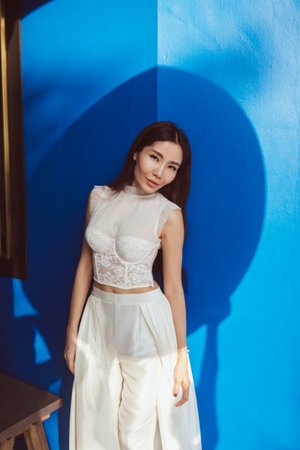 Asian bride in a unique white wedding dress-trouser suitの写真素材