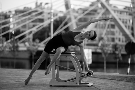 Pilates reformer chair woman fitness yoga gym exercise.の写真素材