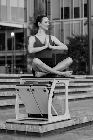 Pilates reformer chair woman fitness yoga gym exercise.の写真素材