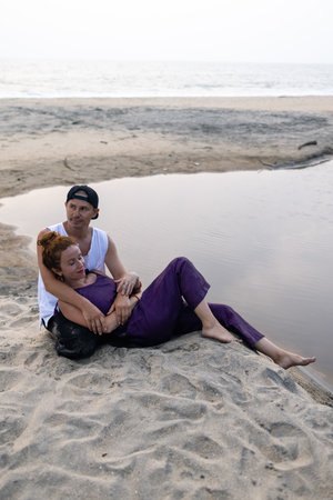 A couple in love embrace on the beach during vacation. There is love between the people.の写真素材
