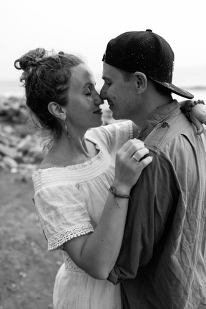 A couple in love embrace on the beach during vacation. There is love between the people.の写真素材