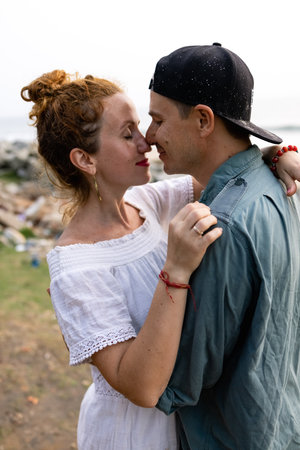 A couple in love embrace on the beach during vacation. There is love between the people.の写真素材