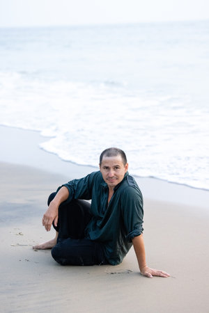 The man has hair after a hair transplant operation on his head. He is showingの写真素材