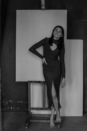 Black and white photo of a beautiful slim Caucasian brunette with fair skinの写真素材