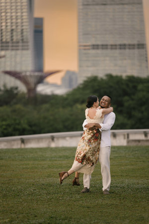 Close-up of an international couple embracing outdoors, stylish and emotional atmosphere.の写真素材
