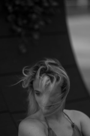 Pretty smiling joyfully female with fair hair, dressed casuallyの写真素材