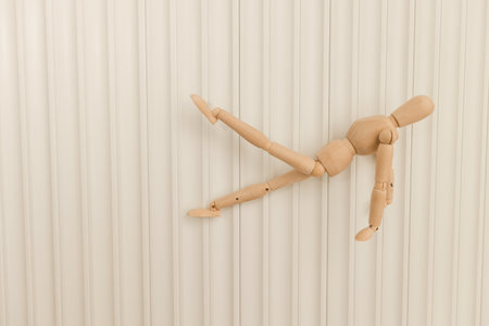 Wooden mannequin showing bridge abdominal exerciseの写真素材