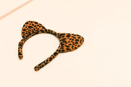 Tiger print womens hairband with animal ears accessory on white background