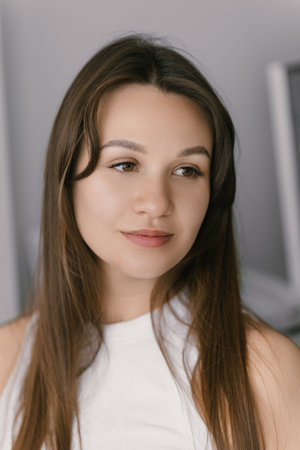 Close up portrait of beautiful young Caucasian brunette woman with fair skin