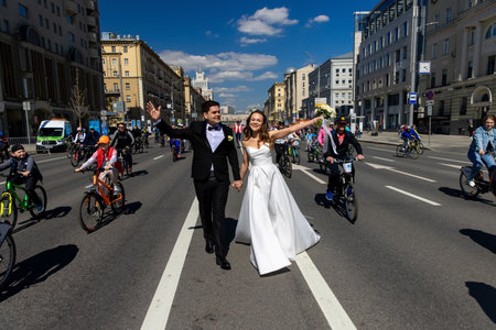MOSCOW - MAY 21, 2022: Wedding couple during Bicycle parade in the center of Moscow on May 21, 2012, Moscow, Russiaのeditorial素材