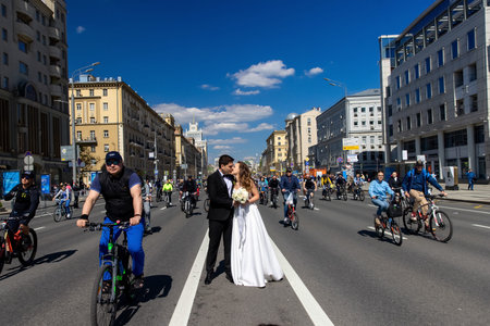 MOSCOW - MAY 21, 2022: Wedding couple during Bicycle parade in the center of Moscow on May 21, 2012, Moscow, Russiaのeditorial素材
