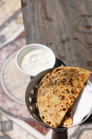Popular Indian food Aloo Paratha with yogurt and pickles aloo paratha with curd