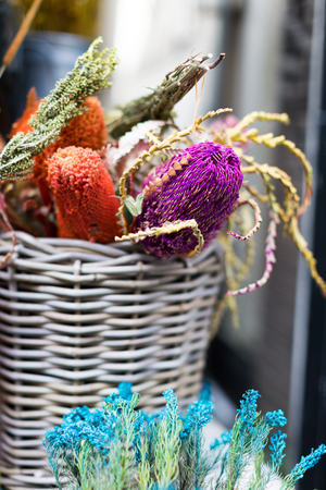 Bouquet of several kind of colorful dry flowers in the basketの写真素材