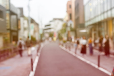 Blurred shopping street with walking people. Defocus image.