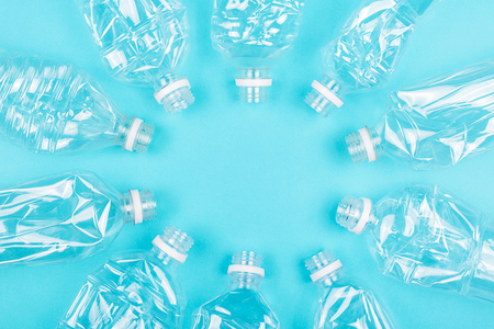 Plastic free and zero waste concept. Many empty plastic bottles on blue background. Flat-lay, top view. Copy space.の写真素材