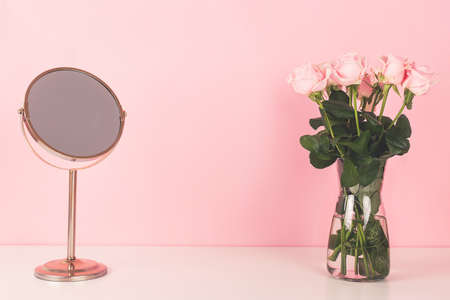 Mirror and beautiful roses. Vanity table concept.の写真素材