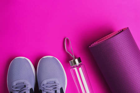 Home workout concept. Sneakers, water bottle and smartphone.の写真素材