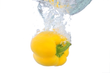 Pepper fruit into the water the momentの写真素材